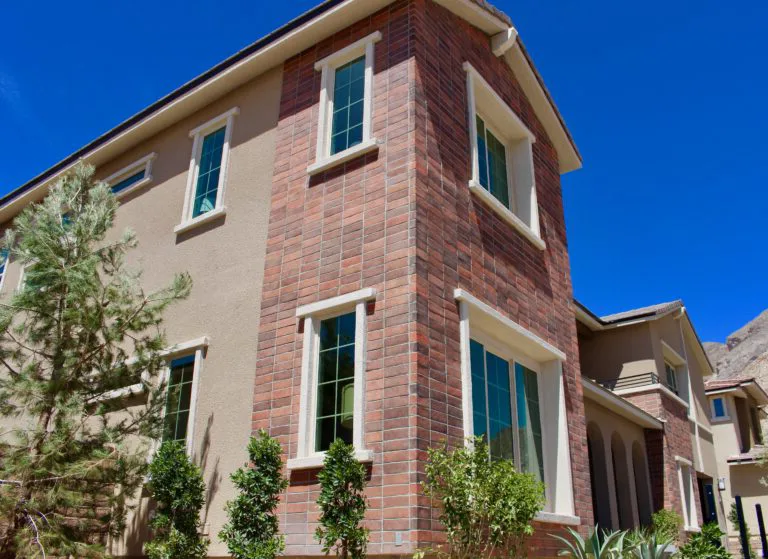 Exterior facade with classic red brick veneer siding on a New Jersey home by ARG Contractor.